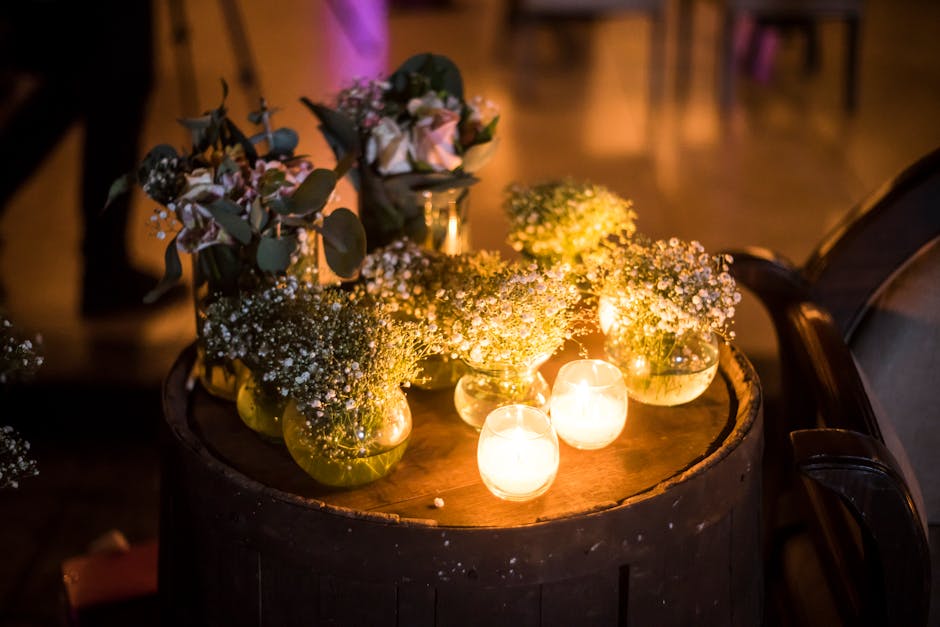 Hurricane candle holders arranged on a dining table