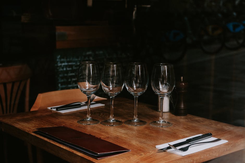 Wine glasses on a formally set dinner table