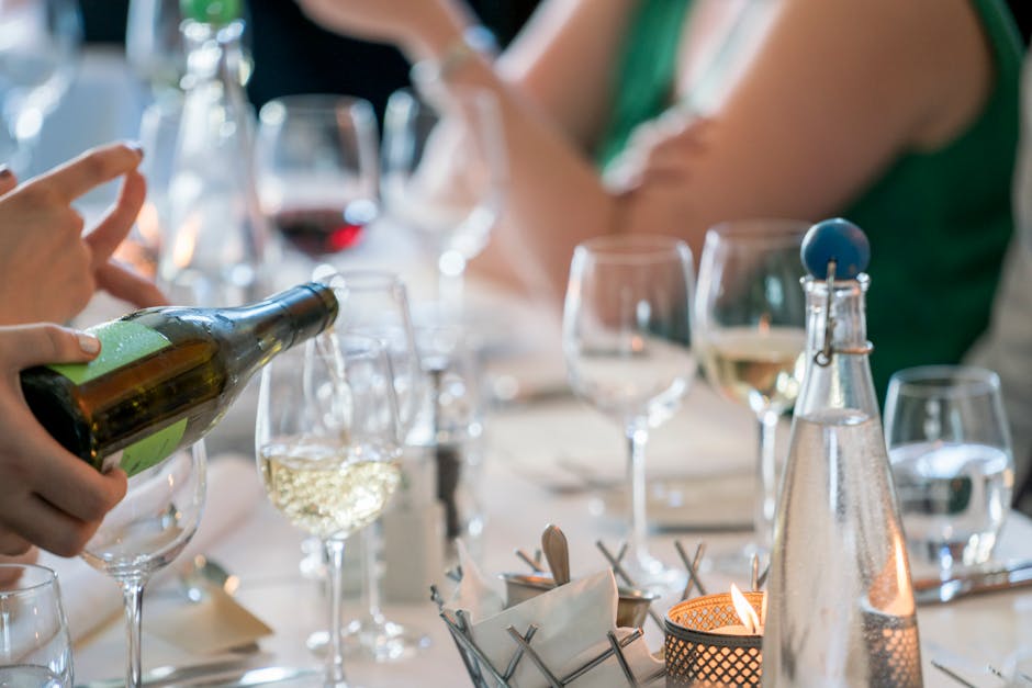 Handblown wine glasses on a rustic wooden table